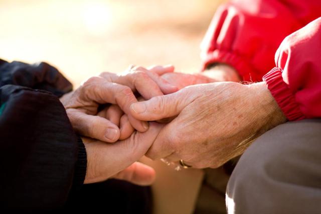 older couple praying